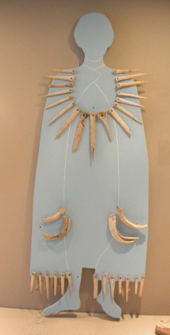 Reconstruction showing a worked bone fringe around original costume